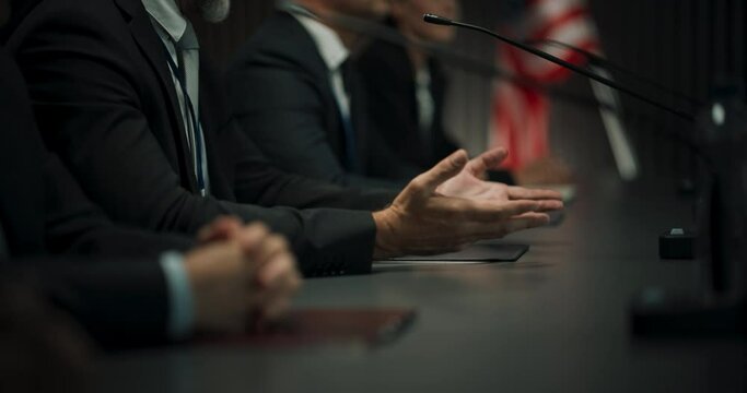Close Up On Hands of Caucasian Male Organization Representative Speaking at Economic Conference. Head Of USA Delegation Delivering Speech at International Political Summit, Delegates Listening.