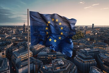 The developing flag of the European Union in the background of a European city and buildings - obrazy, fototapety, plakaty