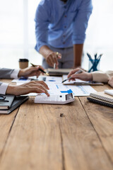 Financial consulting business meeting together to discuss financial chart analysis and brainstorm...