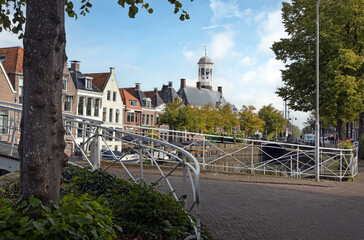 Fototapeta na wymiar City hall and canal at Dokkum. Friesland Netherlands. Bridge. 