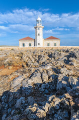 Punta Nati Lighthouse in Menorca, Spain. - 653294593