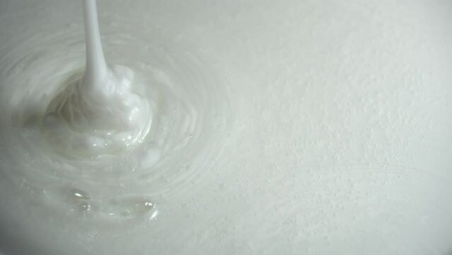 Closeup shot of pouring liquid gel. Washing shampoo, shower gel flowing
