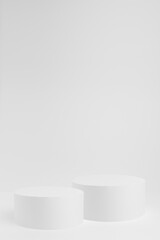 Abstract two white round pedestals for cosmetic products as mockup on white background. Scene for presentation products, gifts, goods, advertising, design, sale, text, showing in simplicity style.