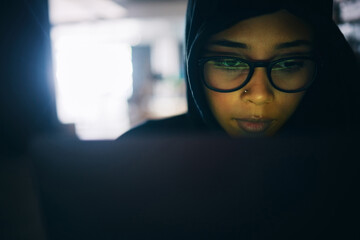 Hacker, woman and face with laptop, information technology for coding and database with phishing and cyber crime. Cybersecurity, programming or hacking, criminal with pc for ransomware and firewall