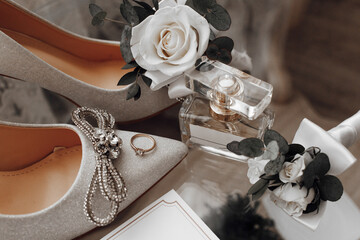 The bride's wedding ring is on the shoes, Perfume. Wedding details