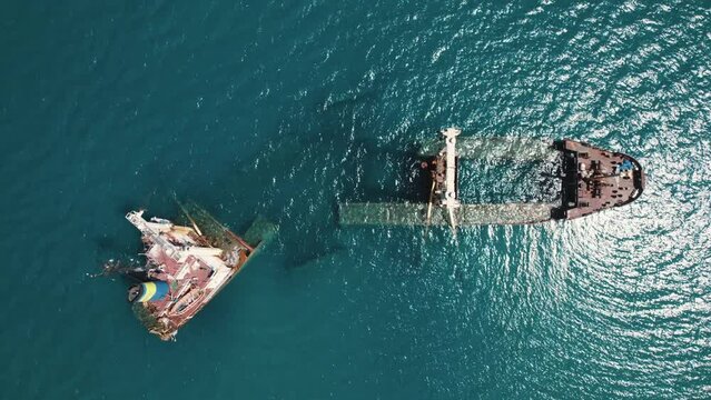 Drone aerial view of Manassa Rose Shipwreck in Kissamos bay. Ship sinking in the vivid blue water. Touristic attraction. High quality 4k footage