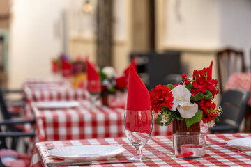 restaurant table with glasses, flowers and deco in the old town of calpe, spain - obrazy, fototapety, plakaty