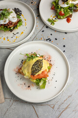 delicious breakfast with poached egg and salmon