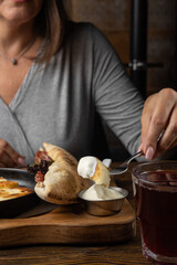 delicious breakfast - cheesecakes with sour cream and jam on a wooden table 