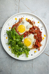 delicious breakfast fried eggs with greens 
