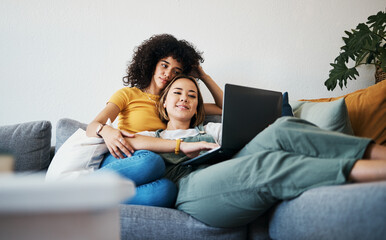 Lgbtq, laptop and couple relax on sofa for watching movies, streaming series and online videos....