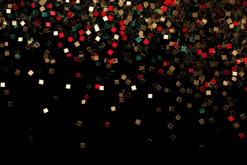 falling golden red green metallic glitter foil confetti on black background, gold holiday and...