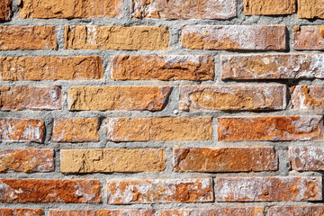 Detail of renovated brick wall of Venetian buildings, rustic texture horizontal design background or wallpaper and copy space.
