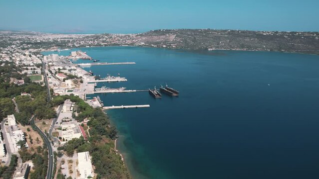 Cretan Souda Bay situated at the head of Ormos Soudas seen during a beautiful sunny day from aerial perspective. Boats and ships. High quality 4k footage