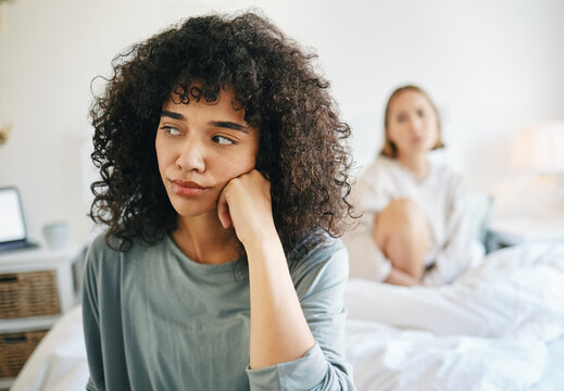 Lgbtq, Woman And Frustrated For Couple Fight In Bedroom Of Home With Conflict, Crisis Or Problem In Relationship. Lesbian, Partner And Girl On Bed With Stress, Anxiety And Depressed For Argument