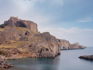 Rhodes, Greece. Lindos small whitewashed village and the Acropolis, scenery of Rhodos Island at...