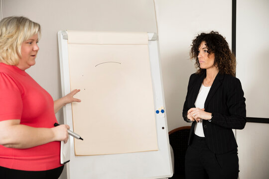 Businesswoman having presentation during business meeting