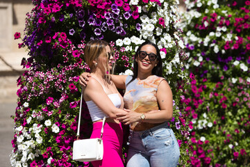 Couple of lesbian and latin women are traveling in spain. Women enjoy holidays in southern spain...