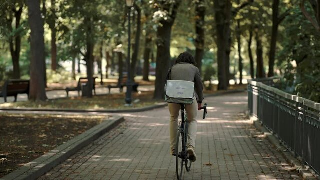 businessman riding his bike to work, commuting by bicycle  
