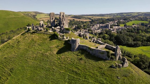 Ascending over Corfe Castle ruins in Dorset