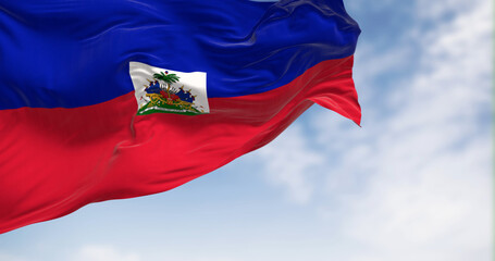 Haiti national flag waving in the wind on a clear day - obrazy, fototapety, plakaty
