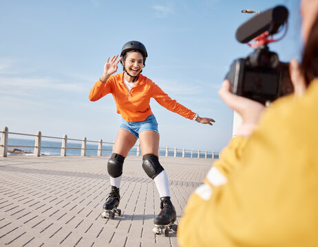 Girl, rollerskates and smile for camera, boardwalk and fun by ocean, sea and outdoors for hobby. Active person, skating and sport in summer, protection and gear for safety, energy and happy in summer