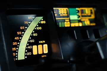 Close up view of a digital speedometer in a vintage car