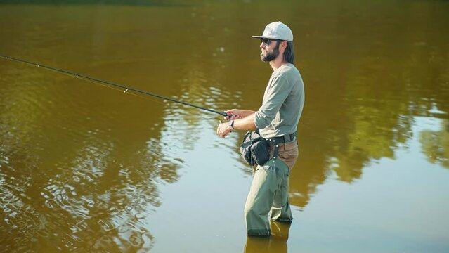 Fisher pilling perch . Angler ultralight catching pike