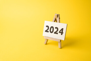 Stand with 2024 inscription. The beginning of a new year. Reflecting on past achievements and...