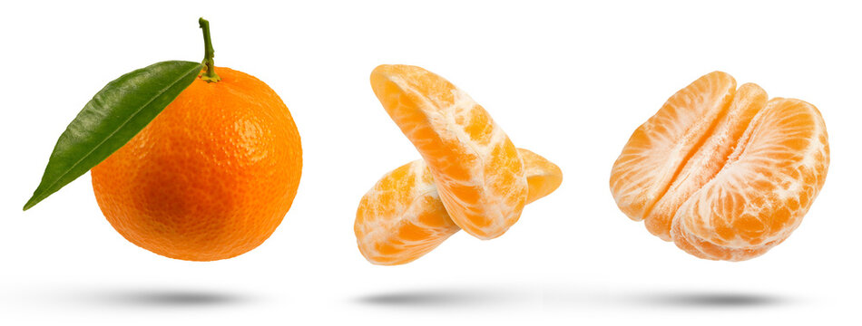 Set of tangerines of different cutting methods on a white isolated background. Differently cut tangerines hang or fall close-up.