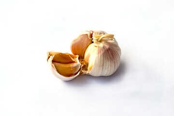 Isolate garlic on a white background. It is a Thai herbal plant and a type of spice. It is often added to many types of food, including Thai food, Indian food.    