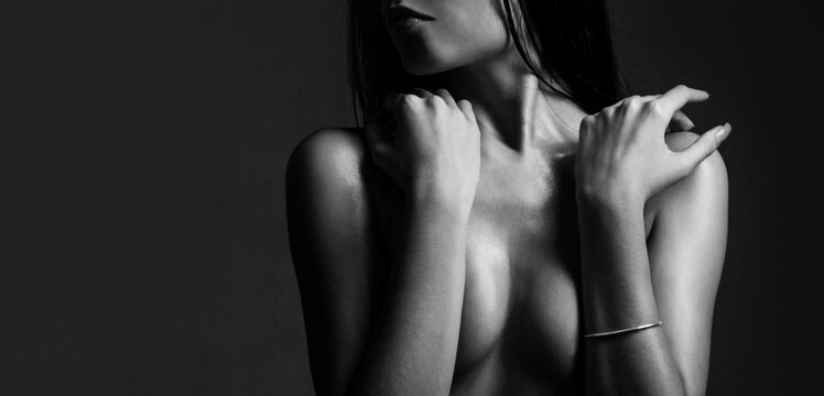Sensual female breast. Women with large breasts. Sexy breast, boobs, tits. Beautiful slim woman body, sexy belly, abdomen. Black and white