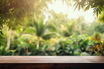 Empty wooden table on a backdrop of tropical foliage on sunny day. Product display template.