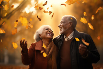 Beautiful cheerful senior couple having fun together in autumn forest. Beautiful sunset on beautiful fall day. Spending quality time together, active leisure.