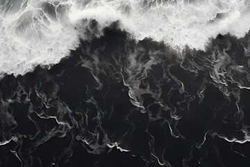 Aerial view of black sand beach and waves, black and white