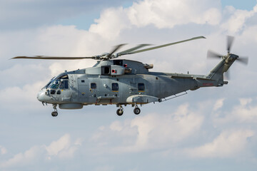 Untitled military helicopter at air base. Air force and army flight transportation. Aviation and rotorcraft. Transport and airlift. Military industry. Fly and flying.