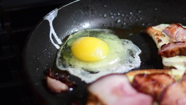 cracking eggs with bacon