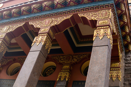 fragment of the facade of a Buddhist datsan Gunzechoinei building with traditional elements