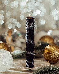 Christmas candle on the festive table. Souvenir gift candles. Year of the Dragon. Selective focus