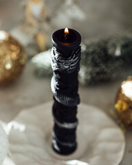 Christmas candle on the festive table. Souvenir gift candles. Year of the Dragon. Selective focus