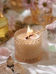 Vegan handmade candle with rose quartz. Soy, coconut candle with wooden wick. Aesthetic interior, eco home decoration. Selective focus
