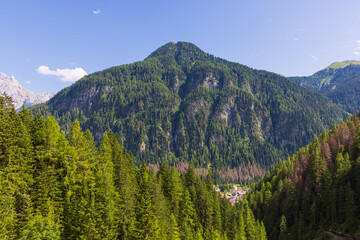 Obraz premium A view of the Dolomites and the countryside into Val di Fassa - Timelapse