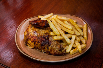 grilled chicken and potatos on a plate