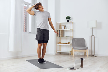 Fototapeta na wymiar man sportswear lifestyle health gray activity home training dumbbells indoor sport