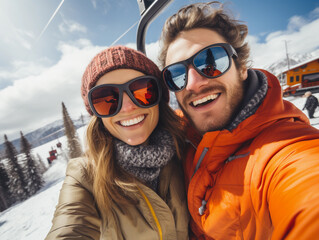 Portrait of happy couple on a gondola at a ski resort make selfie , snowy mountain landscape on background.