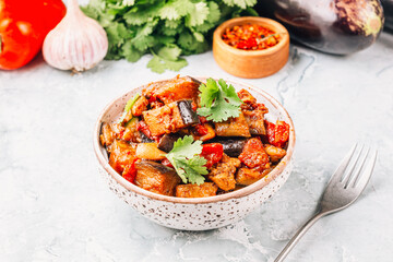 Eggplant and Chicken Warm Salad on Grey Marble Background