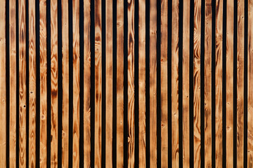 Brown wooden slats as background. Texture of vertical wood strips.