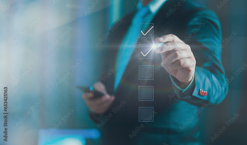 Poster Businessman hand point to tick correct sign mark in checkbox for quality document control checklist and business approve project concept. Task Checklist and filling out survey form online.
