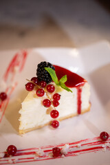 tender cheesecake with berries in a coffee shop