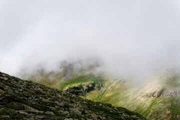 View of flowing water through a cloud in Spanish Pyrenees